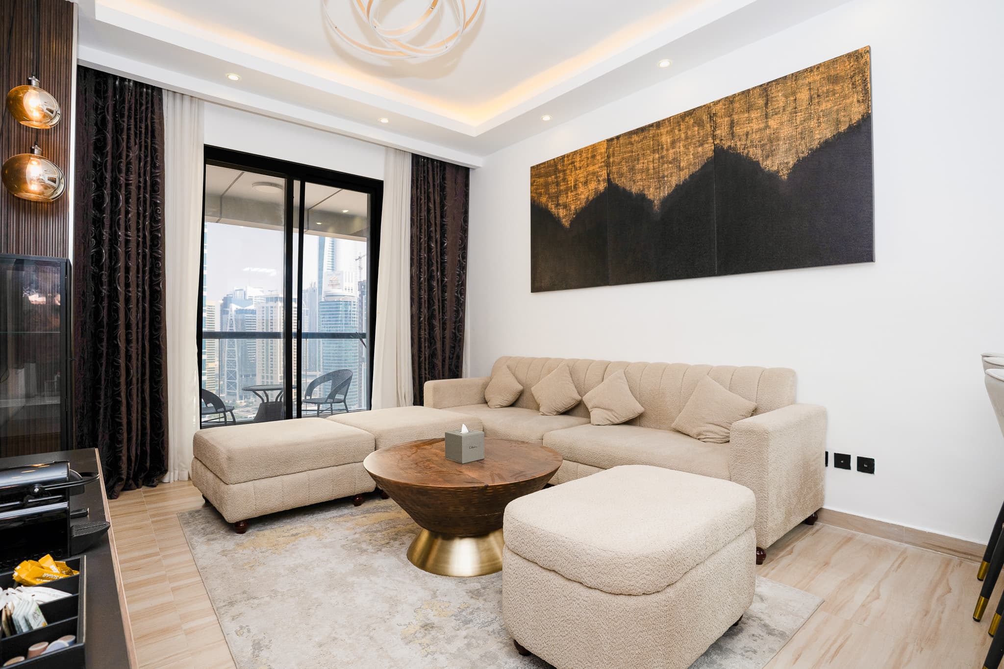 Lounge area with sofa, coffee table and Marina skyline view